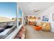 Bright living room with a kitchenette, comfortable seating, and large windows offering stunning views at 402 Garfield St, Denver, CO 80206