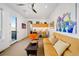 Stylish living room with a sofa, kitchenette, modern decor, and natural light, creating an inviting atmosphere at 402 Garfield St, Denver, CO 80206