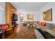 Bright living room with a fireplace, large sectional sofa, and an eye-catching decorative rug at 402 Garfield St, Denver, CO 80206