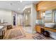 Open bathroom featuring an expansive shower with glass enclosure and double sink vanity at 402 Garfield St, Denver, CO 80206