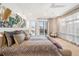 Inviting primary bedroom with serene decor, balcony access, and large windows for natural light at 402 Garfield St, Denver, CO 80206