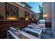 Stylish outdoor seating area with modern furniture and decorative wall panels at 402 Garfield St, Denver, CO 80206