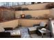 Cozy patio area with comfortable seating, tiered planting beds, and decorative accents for outdoor relaxation at 402 Garfield St, Denver, CO 80206