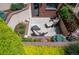 Charming outdoor patio with lounge chairs and lush landscaping surround at 402 Garfield St, Denver, CO 80206
