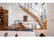 Open staircase design with hardwood steps and metal railings at 402 Garfield St, Denver, CO 80206