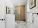 Sleek bathroom with glass-enclosed shower, modern fixtures, and elegant tile at 6894 Nelson St, Arvada, CO 80004