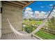 Relaxing balcony view with a comfortable hammock and stunning views of a well-manicured green space at 21345 E 59Th Dr, Aurora, CO 80019
