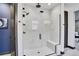 Contemporary bathroom featuring a sleek glass shower with built-in seat and modern fixtures at 21345 E 59Th Dr, Aurora, CO 80019
