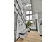 Bright foyer with soaring ceilings, modern staircase, and stylish decor creates a welcoming entrance at 21345 E 59Th Dr, Aurora, CO 80019