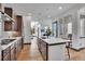 Bright, modern kitchen with a large island, stainless steel appliances, and hardwood floors at 21345 E 59Th Dr, Aurora, CO 80019