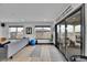 Bright living room with a yoga mat, comfortable seating, and access to a balcony at 21345 E 59Th Dr, Aurora, CO 80019