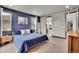 Comfortable main bedroom featuring contemporary furnishings, a plush bed, and ensuite bath access at 21345 E 59Th Dr, Aurora, CO 80019