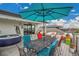 Rooftop deck featuring a hot tub, outdoor dining area, and comfortable lounge seating at 21345 E 59Th Dr, Aurora, CO 80019