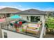 Entertainer's rooftop deck with hot tub, outdoor seating, and panoramic views at 21345 E 59Th Dr, Aurora, CO 80019