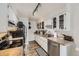 Well-lit kitchen with stainless appliances and ample countertop space at 3141 S Tamarac Dr # 202E, Denver, CO 80231