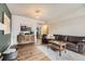 Inviting living room with wood floors and open access to other rooms at 3141 S Tamarac Dr # 202E, Denver, CO 80231