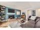 Comfortable living room featuring a fireplace and modern furnishings at 3141 S Tamarac Dr # 202E, Denver, CO 80231
