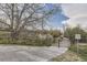 Community walkway featuring a boardwalk, trees, and lush greenery at 3141 S Tamarac Dr # 202E, Denver, CO 80231