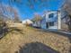 Large backyard features a well maintained lawn and mature trees at 4591 S Fairplay St, Aurora, CO 80015