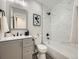 Modern bathroom features marble tile, sleek fixtures, and a stylish vanity at 4591 S Fairplay St, Aurora, CO 80015