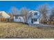 Exterior of home with spacious backyard and neutral paint color at 4591 S Fairplay St, Aurora, CO 80015