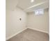 Clean laundry room with tile floor, neutral paint and window for natural light at 4591 S Fairplay St, Aurora, CO 80015