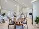 Open living space showcasing a dining area, a modern kitchen, and a comfortable seating area at 4591 S Fairplay St, Aurora, CO 80015