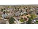 This aerial view showcases the property's location within a tree-filled neighborhood at 6142 Dudley Ct, Arvada, CO 80004