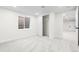 Well-lit basement with new carpet, window, and closet, perfect for additional living space at 6142 Dudley Ct, Arvada, CO 80004