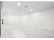 Finished basement area with recessed lighting and plush neutral carpet, ready for customization at 6142 Dudley Ct, Arvada, CO 80004