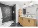 Modern bathroom featuring a marble shower and double sink vanity with designer fixtures at 6142 Dudley Ct, Arvada, CO 80004