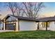Charming single-story home with an attached garage and a well-kept lawn at 6142 Dudley Ct, Arvada, CO 80004