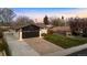 Charming single-Gathering home with a two-car garage and a long driveway at 6142 Dudley Ct, Arvada, CO 80004