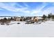 Two-story house with attached garage, snowy landscape at 3891 Windchant, Castle Rock, CO 80104