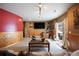 Basement Gathering room has wood paneling, entertainment center, stone accents, and a sofa at 3891 Windchant Cir, Castle Rock, CO 80104
