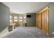 Spacious basement featuring a large bay window seating area and wood-look closet doors at 3891 Windchant Cir, Castle Rock, CO 80104