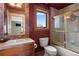 Bathroom features a single vanity, window, tiled walls, and shower with glass doors at 3891 Windchant Cir, Castle Rock, CO 80104