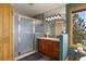 Bathroom with walk-in shower, mountain view, and wood flooring and trim at 3891 Windchant Cir, Castle Rock, CO 80104