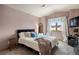 Bedroom with a queen bed, window with a view, and carpeted floors at 3891 Windchant Cir, Castle Rock, CO 80104