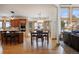Kitchen and eat in area with wood cabinets, granite countertops and large windows overlooking the wintery mountains at 3891 Windchant Cir, Castle Rock, CO 80104