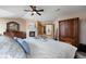 View of main bedroom with a fireplace, ceiling fan, and cozy decorations at 3891 Windchant Cir, Castle Rock, CO 80104