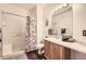Modern bathroom featuring a shower-tub combination and bright lighting at 8976 Fox Dr # 101, Thornton, CO 80260