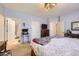 Inviting bedroom featuring a decorative chandelier, soft carpet, and calming color palette at 8976 Fox Dr # 101, Thornton, CO 80260