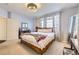 Serene bedroom featuring soft carpet, natural light, and neutral color scheme at 8976 Fox Dr # 101, Thornton, CO 80260