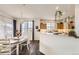 Open dining and kitchen space with hardwood floors and ample natural light at 8976 Fox Dr # 101, Thornton, CO 80260