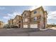 Charming multi-story townhouse boasts a private two-car garage and timeless brick facade at 8976 Fox Dr # 101, Thornton, CO 80260