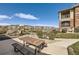 Community playground and picnic area surrounded by landscaping at 8976 Fox Dr # 101, Thornton, CO 80260