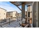 Balcony overlooking neighborhood with chairs and covered snow at 7856 W 43Rd Pl, Wheat Ridge, CO 80033