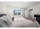 Bedroom with a cozy bed, natural light, and ensuite access at 7856 W 43Rd Pl, Wheat Ridge, CO 80033