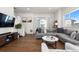 Bright and airy living room with hardwood floors, comfortable seating, and modern decor at 7856 W 43Rd Pl, Wheat Ridge, CO 80033